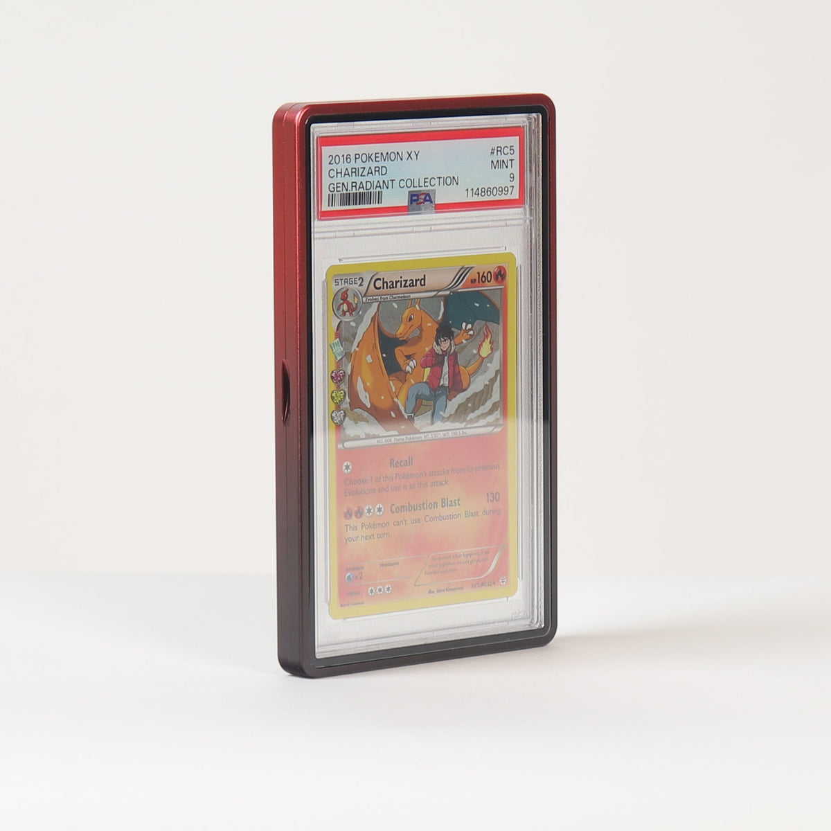 A graded collectible card in a clear plastic slab with a red top border, standing upright on a white surface against a white background.