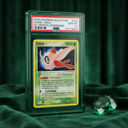 Celebi trading card in a protective case on a green fabric background