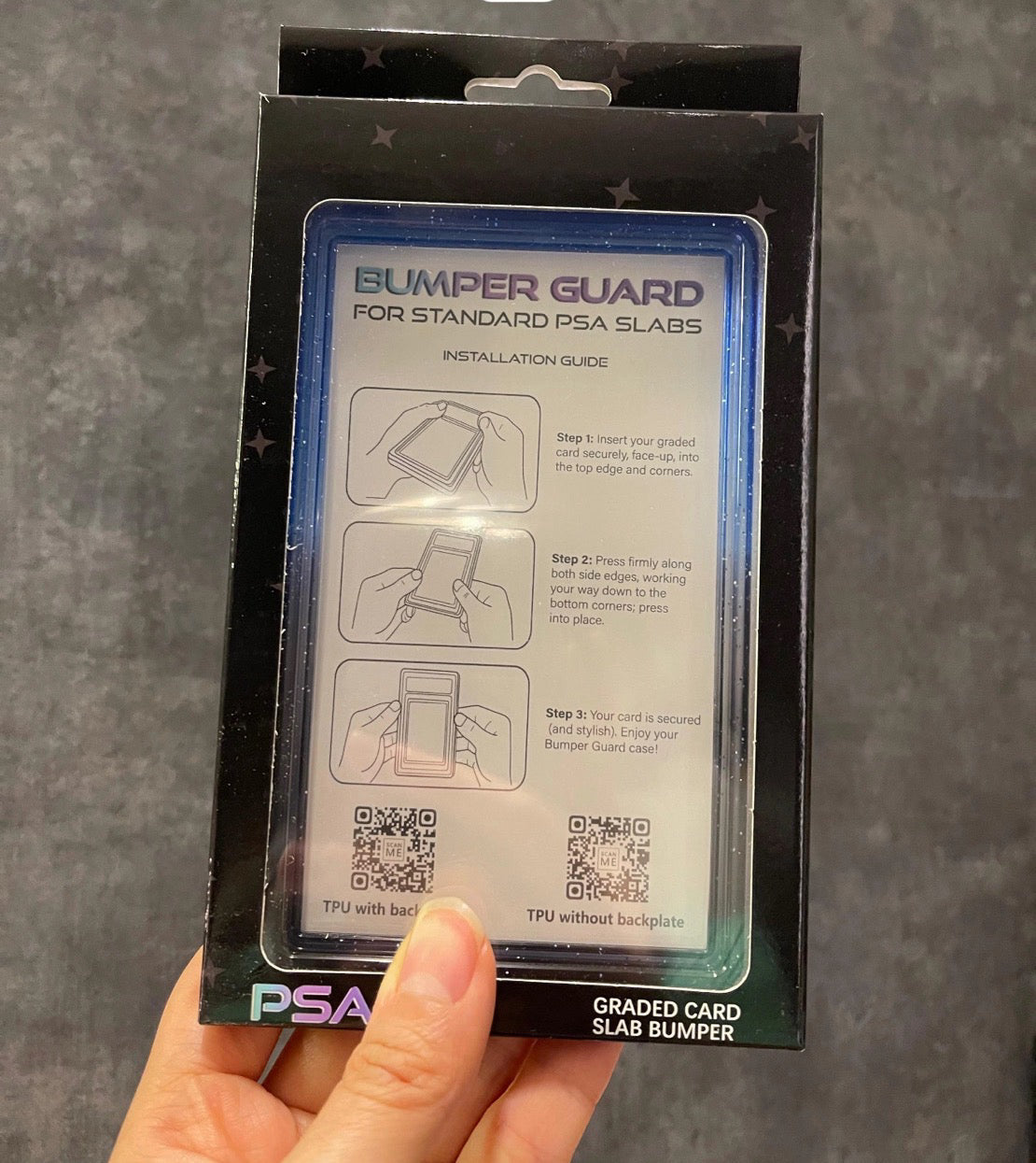 PSA Graded Card Slab Bumper packaging with installation guide on a gray background