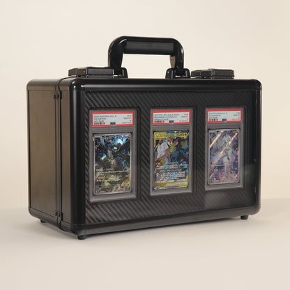 Black carrying case with three trading card packs on a beige background